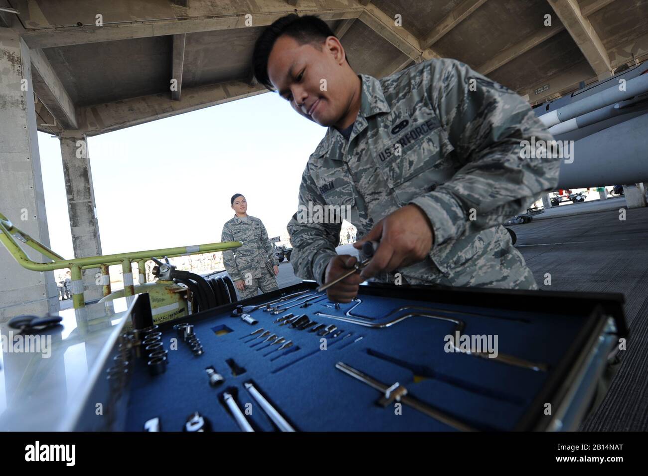 U.S. Air Force Senior Airman Melchorcrispin Borja, a weapons load team member assigned to the 44th Aircraft Maintenance Unit, inspects a tool box during an annual weapons load competition Jan. 3, 2018, on Kadena Air Base, Japan. Once the missiles are loaded, teams must ensure all tools are accounted for. (U.S. Air Force photo by Staff Sgt. Micaiah Anthony) Stock Photo