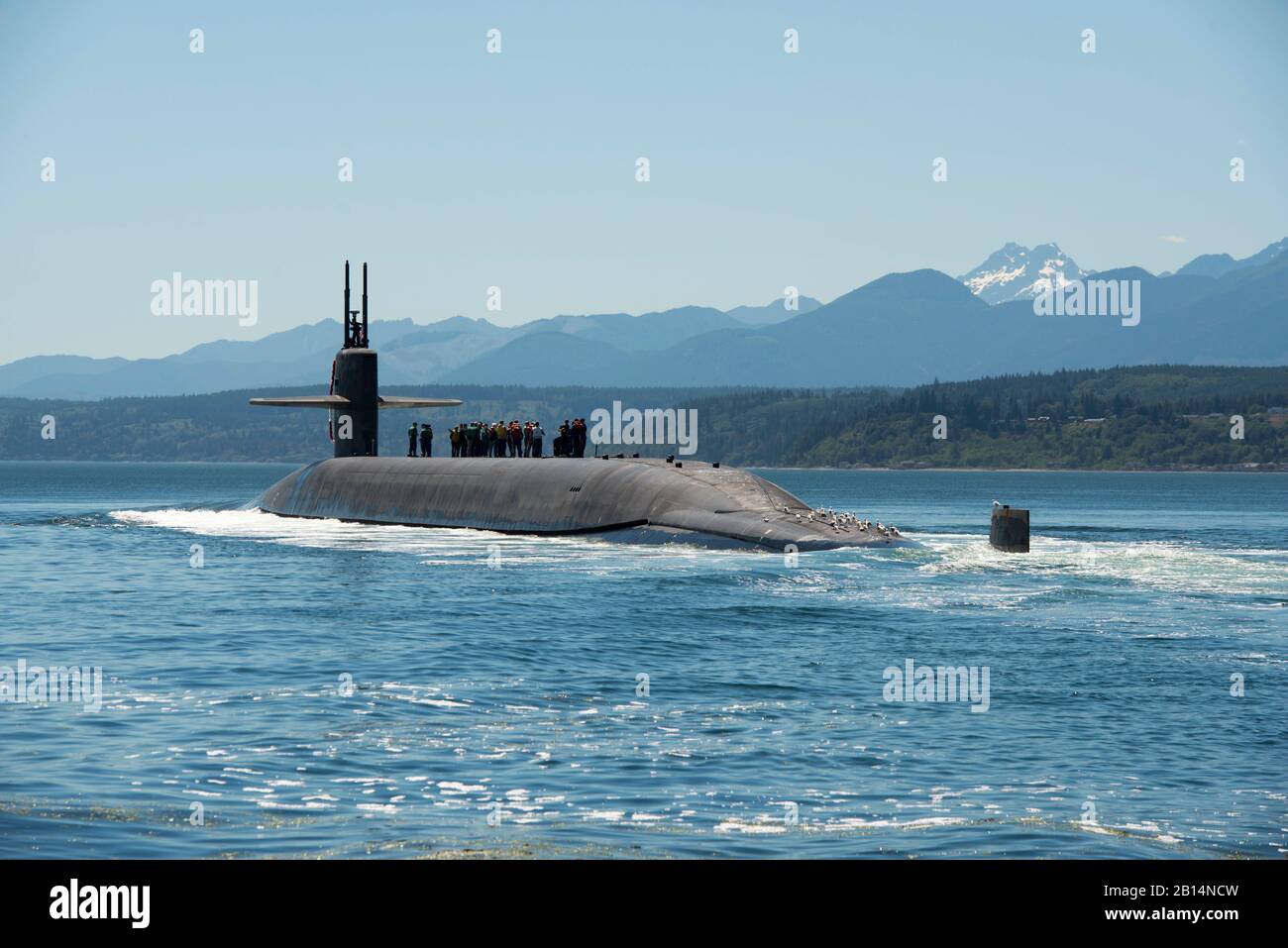 The Ohio-class ballistic missile submarine USS Nebraska (SSBN 739) transits the Hood Canal as it returns home Naval Base Kitsap-Bangor, Washington, following the boat's first strategic patrol since 2013. Nebraska recently completed a 41-month engineered refueling overhaul, which will extend the life of the submarine for another 20 years. (U.S. Navy photo by Mass Communication Specialist 1st Class Amanda R. Gray) Stock Photo