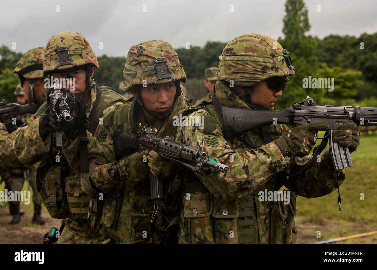 Japan Ground Self-Defense Force soldiers prepare to enter a building during  military operations on urbanized terrain, Aug. 16, 2017, in Hokudaien, Japan during Northern Viper 17. 'MOUT simulates being in an urban combat environment. This gives the military members more accurate training in what they could be dealing with in the future,' said Staff Sgt. Yahshua Ervin. Northern Viper is a combined-joint exercise designed to enhance regional cooperation between the U.S. and Japan. Marines with 1st Battalion, 3rd Regiment, 3rd Marine Division are forward deployed to Japan as part of the Unit Depl Stock Photo