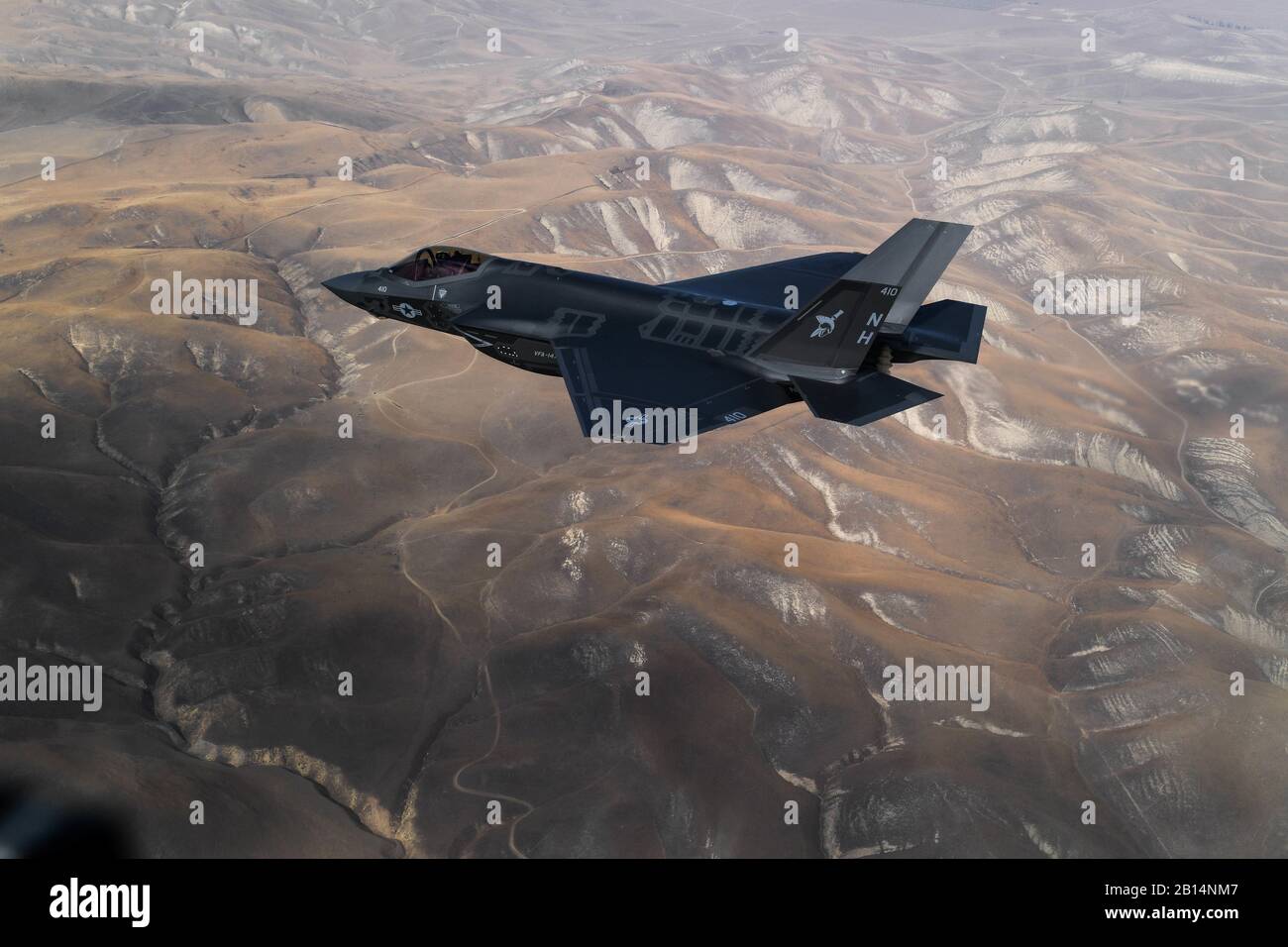 A U.S. Navy F-35C Lightning II, attached to the 'Argonauts' of Strike Fighter Squadron (VFA) 147, stationed at Naval Air Station (NAS) Lemoore, California, fly in formation for a photo exercise over California Nov. 16, 2018. VFA-147 is the first U.S. Navy Operational F-35C squadron based out of NAS Lemoore. Commander, Joint Strike Fighter Wing, NAS Lemoore, ensures that each F-35C squadron is fully combat-ready to conduct carrier-based, all-weather, attack, fighter and support missions for Commander, Naval Air Forces.  With its stealth technology, advanced sensors, weapons capacity and range, Stock Photo