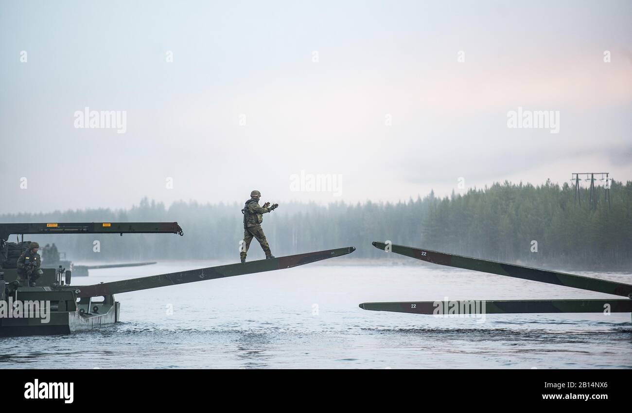German soldiers from 2 Company Multinational Engineer Battalion of NATO’s Very High Readiness Joint Task Force, man an M3 Amphibious Rig while conducting river crossing training duting exercise Trident Juncture at Camp Røedsmoen in Rena, Norway on October 23, 2018.(U.S. Army photo by Sgt Marc-André Gaudreault) Stock Photo