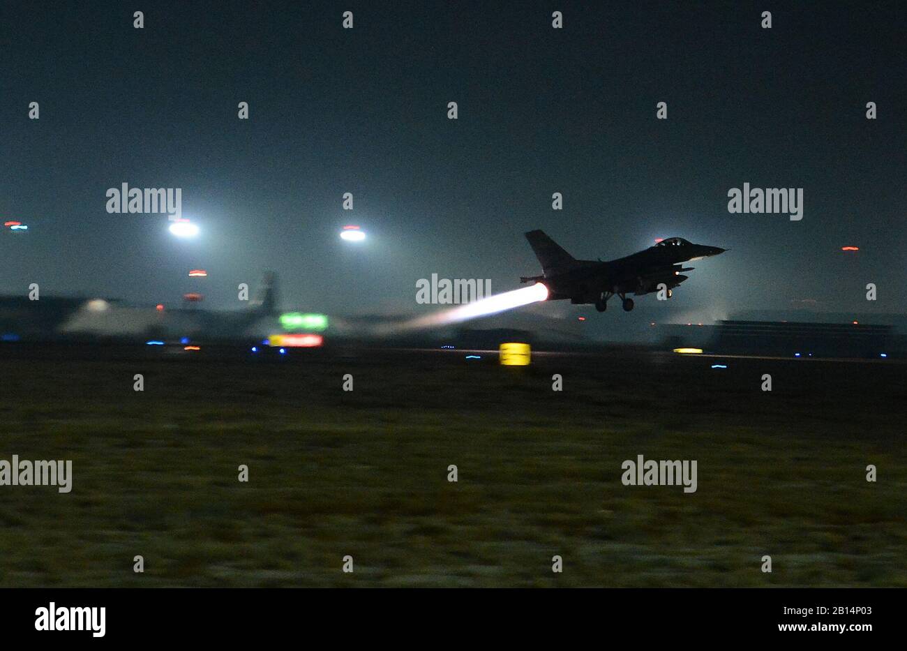 A U.S. Air Force F-16 Fighting Falcon assigned to the 77th Fighter Squadron, takes off Nov. 21, 2017, at Bagram Airfield, Afghanistan. The launch was used in support of a new offensive campaign. Afghan National Defense and Security Forces (ANDSF) and United States Forces-Afghanistan (USFOR-A) launched a series of ongoing attacks to hit Taliban revenue streams. Together, Afghan and U.S. forces conducted combined operations to strike drug labs and command-and-control nodes in northern Helmand province. These types of strikes represent the highest level of trust and cooperation between ANDSF and Stock Photo