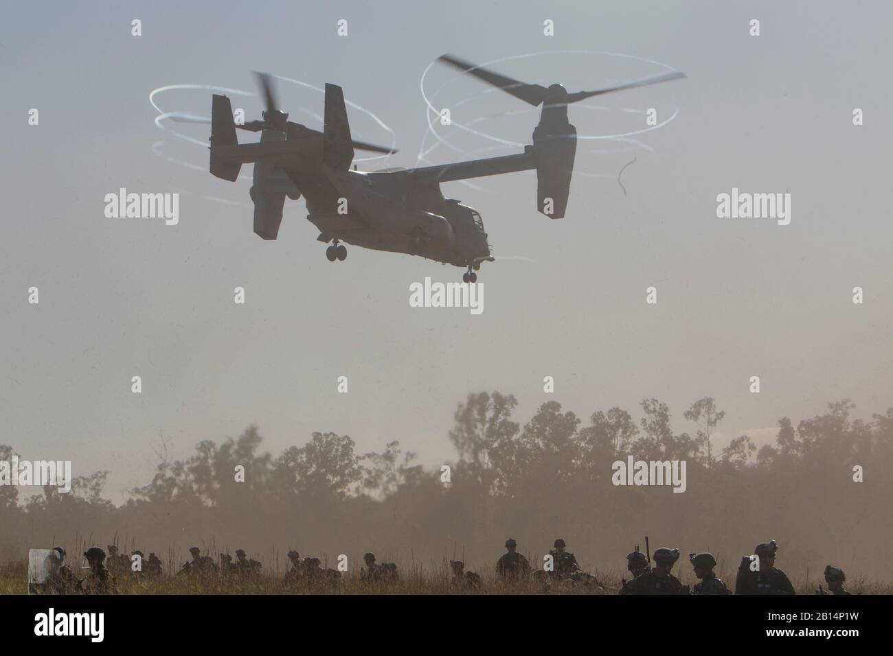 An MV-22B Osprey tiltrotor aircraft takes off after dropping off Marines with Kilo Company, Battalion Landing Team, 3rd Battalion, 5th Marines, during an embassy reinforcement exercise a part of Certification Exercise at Shoalwater Bay Training Area, Queensland, Australia, Aug. 11, 2017. BLT 3/5 is the Ground Combat Element of the 31st Marine Expeditionary Unit. The 31st MEU and Amphibious Squadron 11 are conducting Certification Exercise, the final evaluation in a series of training exercises which ensure readiness for crisis response throughout the Indo-Asia-Pacific region. The 31st MEU part Stock Photo