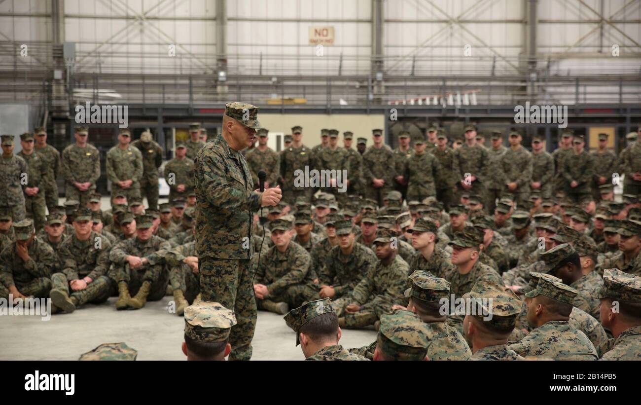 Commandant of the Marine Corps Gen. Robert B. Neller addresses Marines and Sailors assigned to Special Purpose Marine Air-Ground Task Force-Crisis Response-Africa, during a ceremony at Naval Air Station Sigonella, Italy, Dec. 25, 2017. Neller and Sgt. Maj. Ronald L. Green, sergeant major of the Marine Corps stopped by NAS Sigonella to spend time with SPMAGTF-CR-AF service members during the holidays. SPMAGTF-CR-AF is deployed to conduct crisis-response and theater-security operations in Europe and Africa. (U.S. Marine Corps photo by Lance Cpl. Patrick Osino) Stock Photo