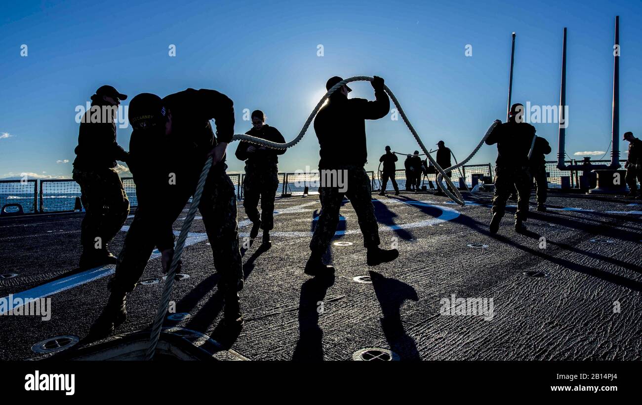 171222-N-KA046-0061 SPLIT, Croatia (Dec. 22, 2017) Sailors handle line aboard the Arleigh Burke-class guided-missile destroyer USS Carney (DDG 64), while mooring in Split, Croatia, for a scheduled port visit. Carney, forward-deployed to Rota, Spain, is on its fourth patrol in the U.S. 6th Fleet area of operations in support of regional allies and partners, and U.S. national security interests in Europe. (U.S. Navy photo by Petty Officer 2nd Class James R. Turner/Released) Stock Photo
