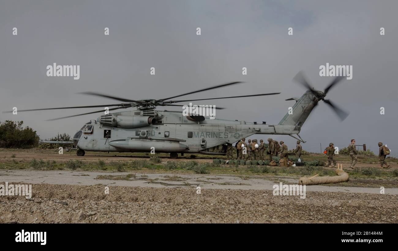 U.S. Marines with Marine Wing Support Squadron (MWSS) 373, Marine Wing Support Group (MWSG) 37, 3rd Marine Aircraft Wing (MAW), unload gear from a CH-53E Super Stallion on the runway at Airport in the Sky on Catalina Island, California, Jan. 9, 2019. The partnership between the Marine Corps and the Catalina Island Conservancy provides a unique opportunity to conduct applicable training while also helping the community. (U.S. Marine Corps photo by Cpl. Samuel Ruiz) Stock Photo