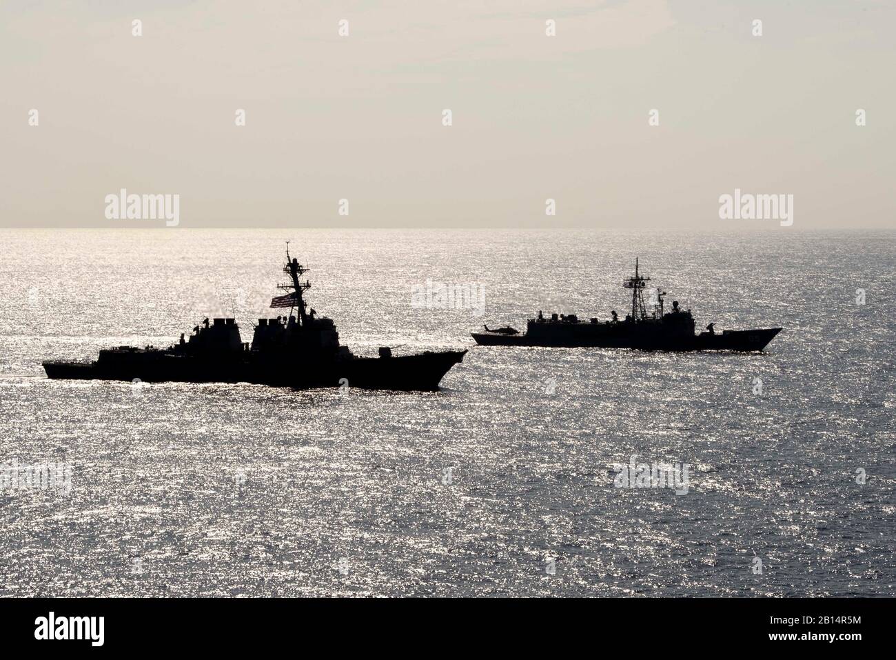 190418-N-UI104-0745     PHILIPPINE SEA (April 18, 2019) The Arleigh Burke-class guided-missile destroyer USS Preble (DDG 88) and the Royal Australian Navy Adelaide-class guided-missile frigate HMAS Melbourne (FFG 05) transit in formation during a cooperative deployment. Preble and Melbourne are participating in a cooperative deployment in order to improve on maritime capabilities between partners.  Preble is deployed to the U.S 7th Fleet area of operations in support of security and stability in the Indo-Pacific region. (U.S. Navy photo by Mass Communication Specialist 1st Class Bryan Niegel/R Stock Photo