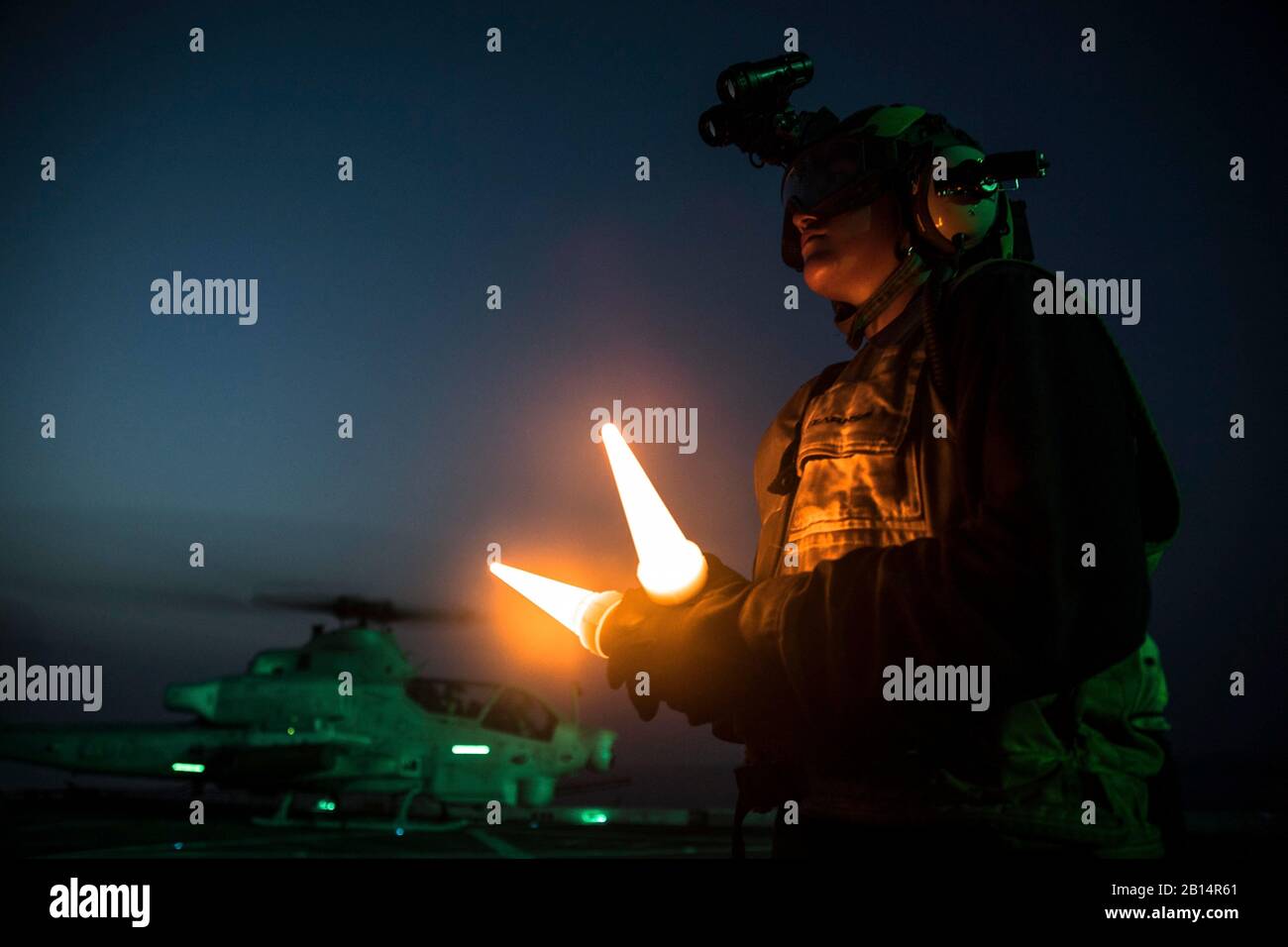 U.S. Navy Aviation Boatswain Mate (Handling) 3rd Class Esmerelda Hernandez, assigned to the air department aboard the amphibious transport dock ship USS San Diego (LPD 22), prepares to conduct flight operations on the ship’s flight deck in support of exercise Alligator Dagger in the U.S. 5th Fleet Area of Operations in the Indian Ocean, Sept. 9, 2017. Alligator Dagger is a dedicated, unilateral combat rehearsal led by Naval Amphibious Force, Task Force 51/5th Marine Expeditionary Brigade, in which combined Navy and Marine Corps units of the America Amphibious Ready Group and embarked 15th Mari Stock Photo