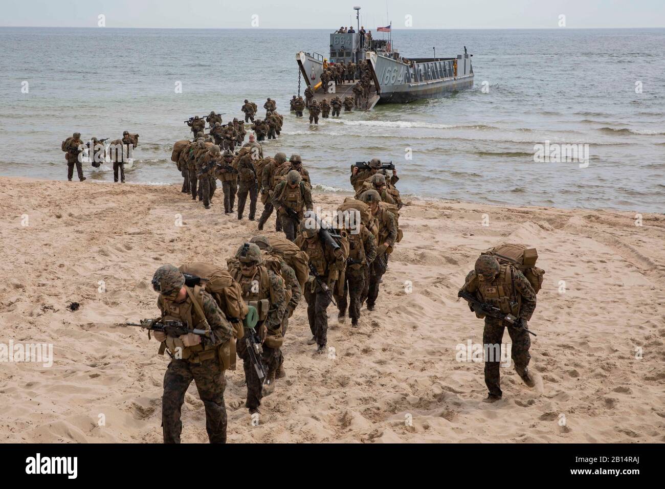 190619-M-QF372-1167 Sweden (June 19, 2019) – U.S. Marines disembark a Landing Craft, Utility during a tactics exercise in Sweden for Baltic Operations (BALTOPS) 2019. The Marines a part of Charlie Company, Battalion Landing Team 1st Battalion, 2nd Marine Regiment, maneuvered and assaulted an objective as a company for the exercise. BALTOPS is an annual joint, multinational maritime-focused exercise. It is designed to improve training for participants, enhance flexibility and interoperability, and demonstrate resolve among allied and partner forces in defending the Baltic Sea region. (U.S. Mari Stock Photo