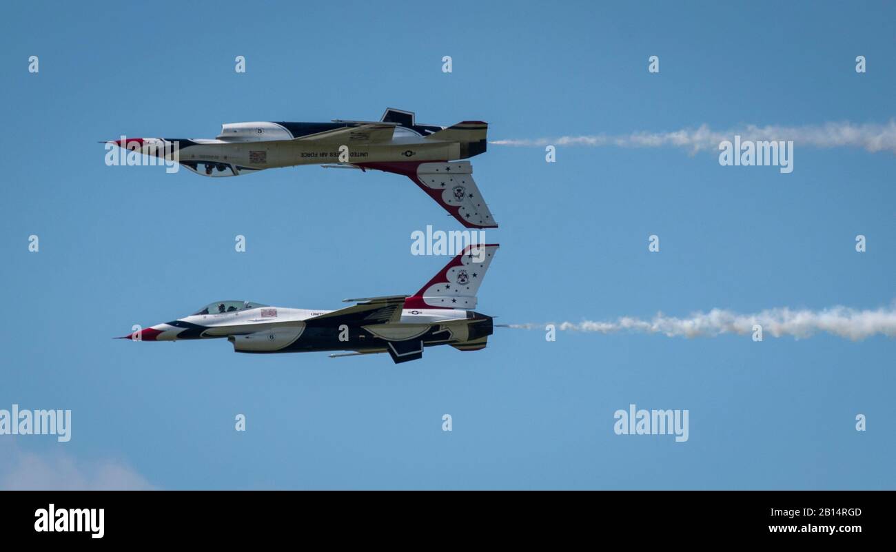 The U.S. Air Force Thunderbirds perform an aerial maneuver during Airpower Over Hampton Roads JBLE Air and Space Expo at Joint Base Langley-Eustis, Virginia, May 20, 2018. This performance marked the Thunderbirds’ official return to their 2018 air show season. The pilots perform approximately 40 maneuvers during each demonstration. (U.S. Air Force photo by Staff Sgt. Areca T. Bell) Stock Photo