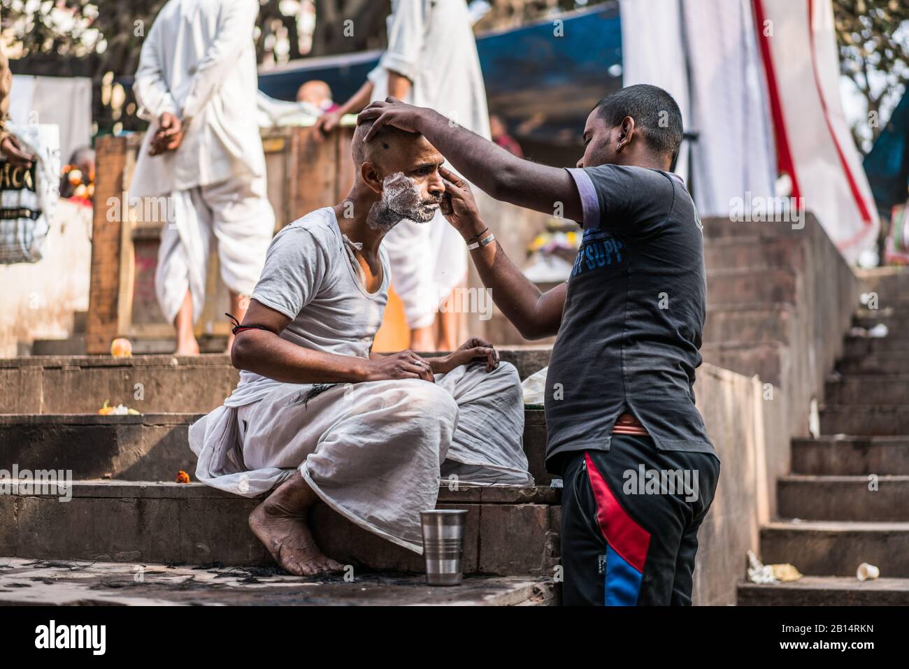 Ritual hair cut hinduism hi-res stock photography and images - Alamy
