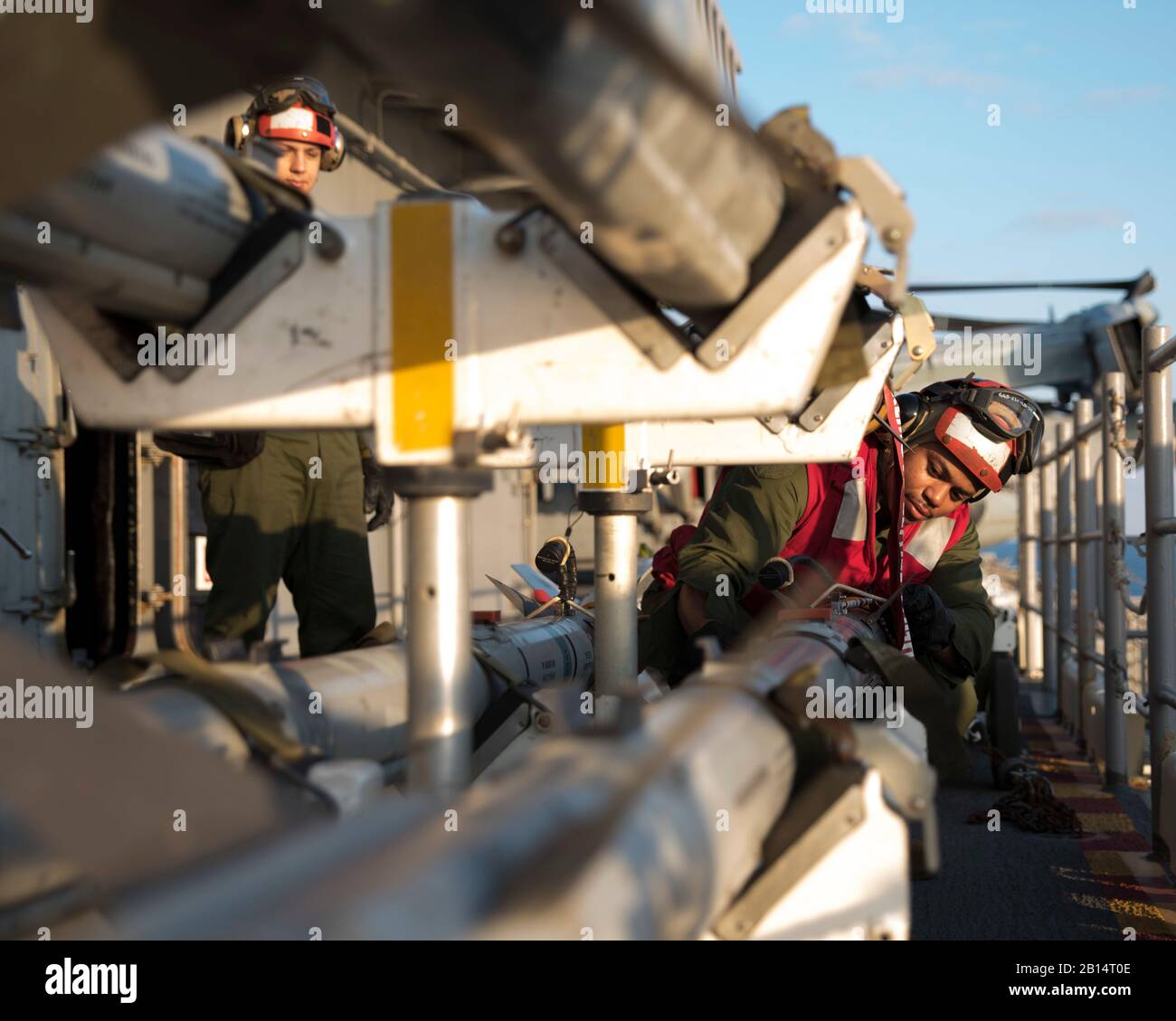 U.S. Marine Corps Cpl. Iquan Strickland, from Harrisburg, Pennsylvania, prepares to load Captive Air Training Missiles (CATM) 9X onto F-35B Lightning II aircraft with Marine Fighter Attack Squadron (VMFA) 121 aboard the amphibious assault ship USS Wasp (LHD 1) in the Philippine Sea Jan. 28, 2019. The Wasp, flagship of Wasp Amphibious Ready Group, with embarked 31st Marine Expeditionary Unit, is operating in the Indo-Pacific region to enhance interoperability with partners and serve as a ready-response force for any type of contingency. (U.S. Navy photo by Mass Communication Specialist 3rd Clas Stock Photo