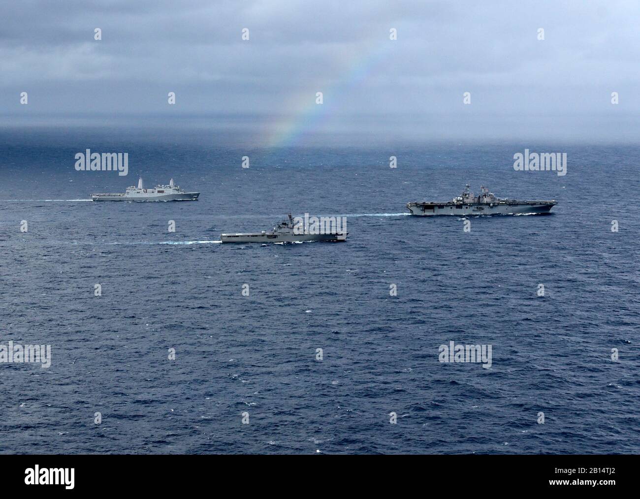 The amphibious transport dock ship USS Green Bay (LPD 20), Japan Maritime Self-Defense Force amphibious transport dock ship JS Kunisaki (LST 4003), and amphibious assault ship USS Wasp (LHD 1) transit in formation during a cooperative deployment in the East China Sea Jan. 12, 2019. The Wasp, flagship of Wasp Amphibious Ready Group, is operating in the Indo-Pacific region to enhance interoperability with partners and serve as a ready-response force for any type of contingency. (U.S. Navy photo by Mass Communication Specialist 1st Class Daniel Barker) Stock Photo