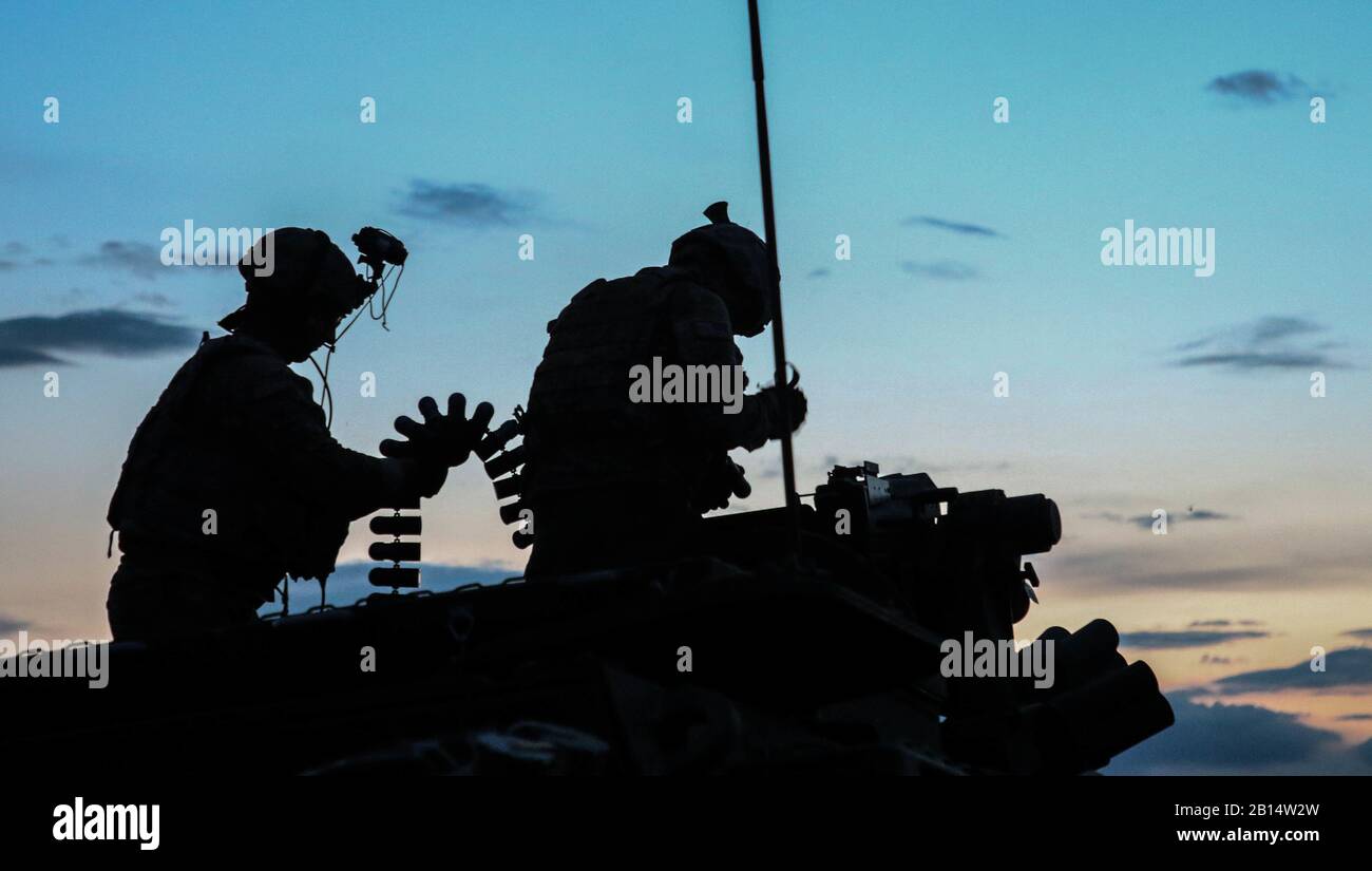 U.S. Soldiers from Alpha Company, 1st Battalion, 111th Infantry, 56th Stryker Brigade Combat Team prepare rounds while anticipating the start of the live-fire iteration of the Combined Arms Live Fire Exercise during Exercise Decisive Strike 2019 at the Training Support Centre, Krivolak, North Macedonia, June 11, 2019. Combined training enables allies and partners to respond more effectively to regional crises and meet their own national defense goals. (U.S. Army photo by Pfc. Ashunteia’ Smith) Stock Photo