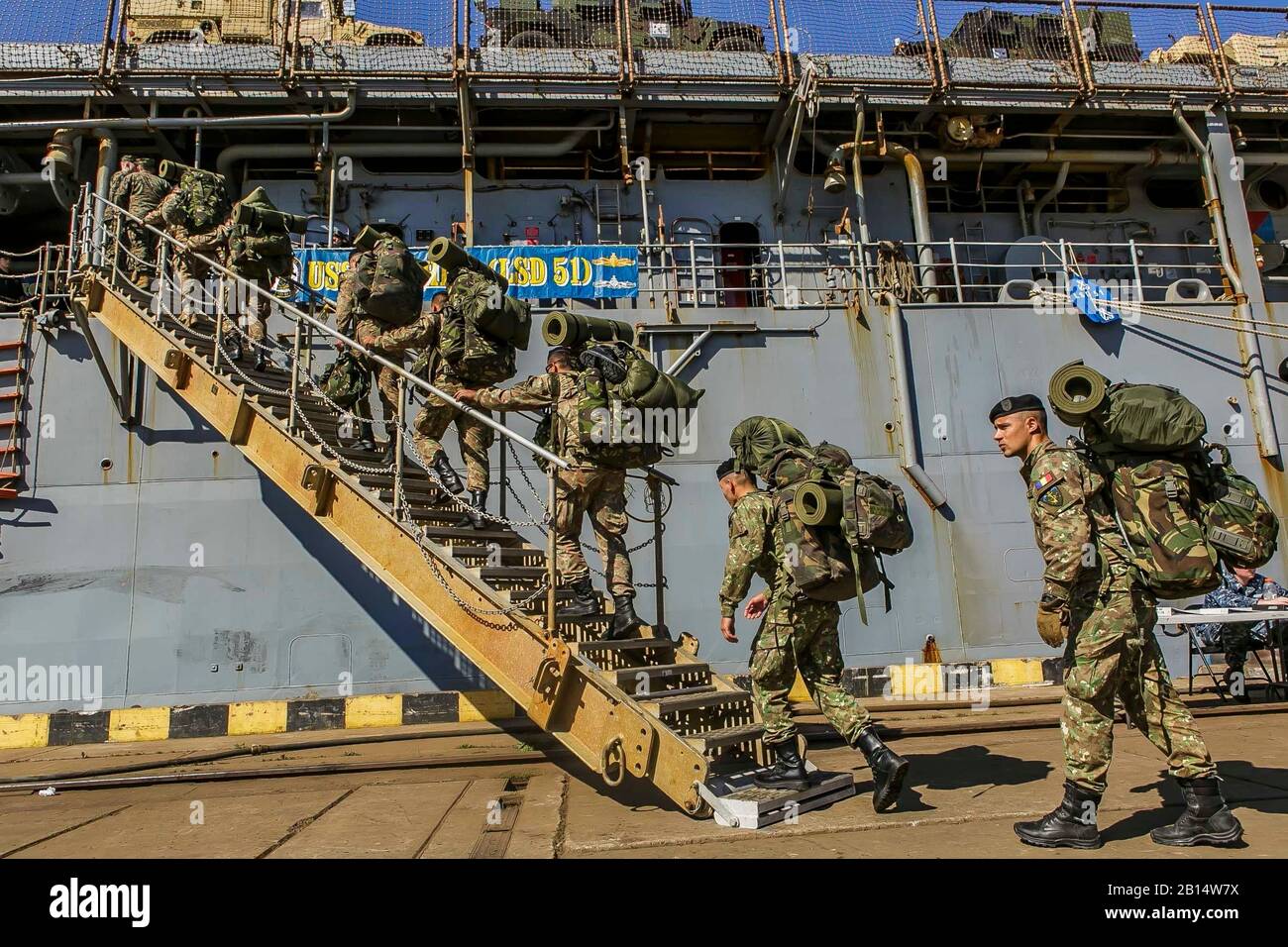 Members of the Romanian 307th Naval Infantry Battalion embark the Harpers Ferry-class dock landing ship USS Oak Hill (LSD 51) to begin training together with U.S. Marines assigned to the 26th Marine Expeditionary Unit (MEU) embarked on the ship as part of exercise Baltic Operations (BALTOPS) at Klaipeda, Lithuania, June 2, 2018. BALTOPS is an annual, multinational exercise designed to enhance interoperability and demonstrate NATO and partner force resolve to defend the Baltic region. (U.S. Marine Corps photo by Staff Sgt. Dengrier M. Baez) Stock Photo