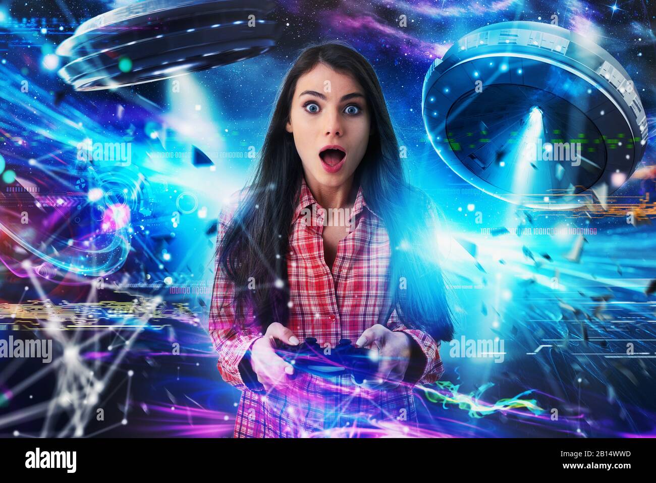Shocked girl plays with online ufo videogames. Concept of technology and entertainment Stock Photo