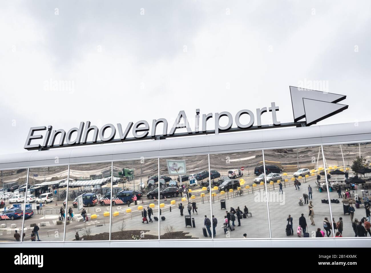 Passengers in front of Modern architecture Eindhoven airport, Holland. Stock Photo