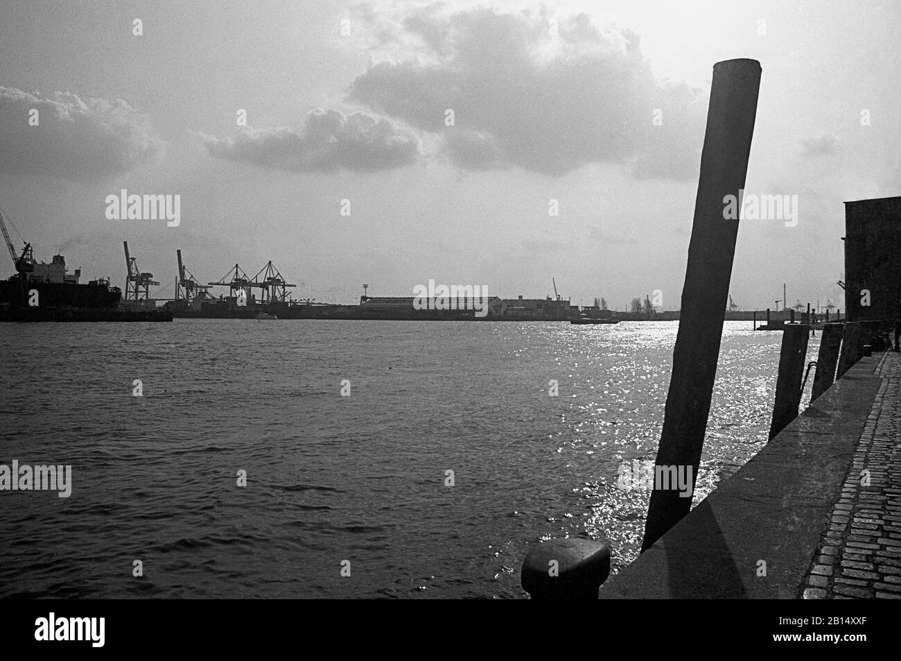 View down the Elbe across the harbour from St. Pauli Fischmarkt, Hamburg, Germany, circa 1988.  Black and white film photograph Stock Photo