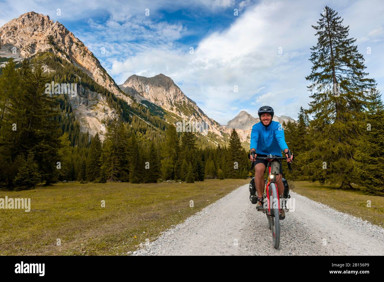 Cyclist, mountain biker bikes on gravel road, Karwendeltal, way to the Karwendelhaus, Tyrol, Austria Stock Photo