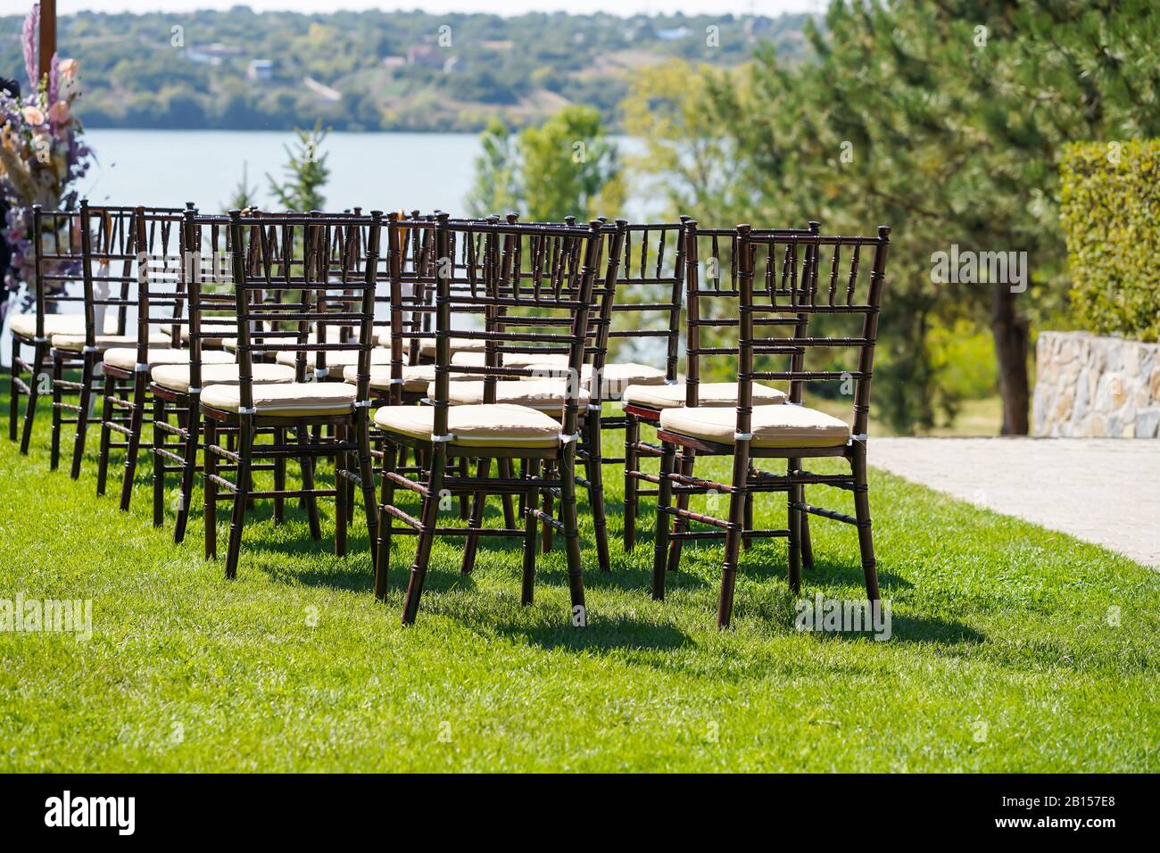 Rows of chairs for guests at an openair wedding ceremony Stock Photo Alamy