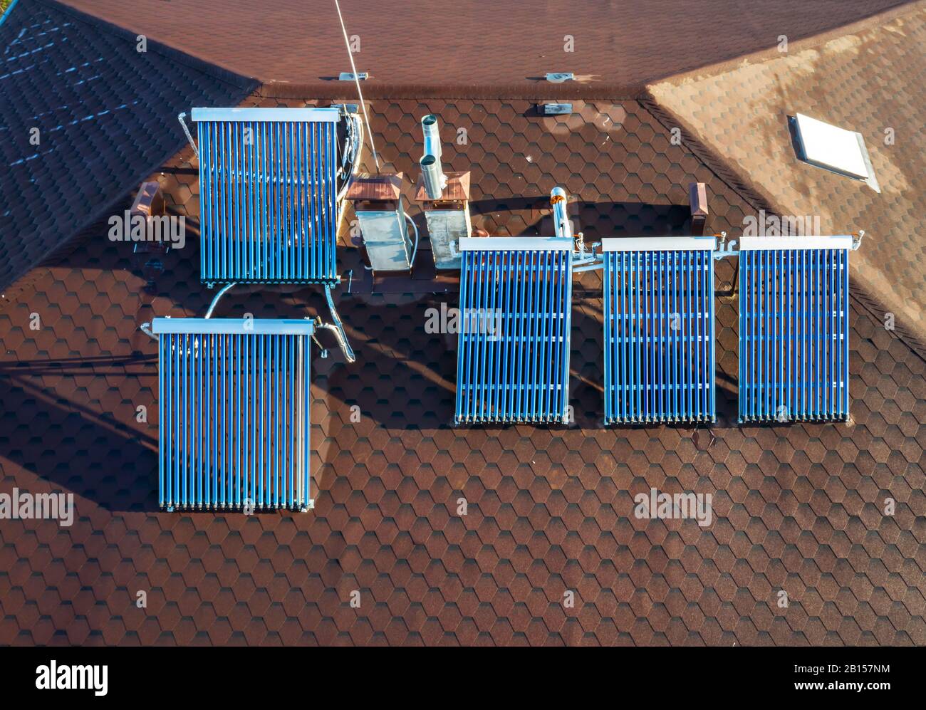 Solar water heater installed on a roof Stock Photo - Alamy