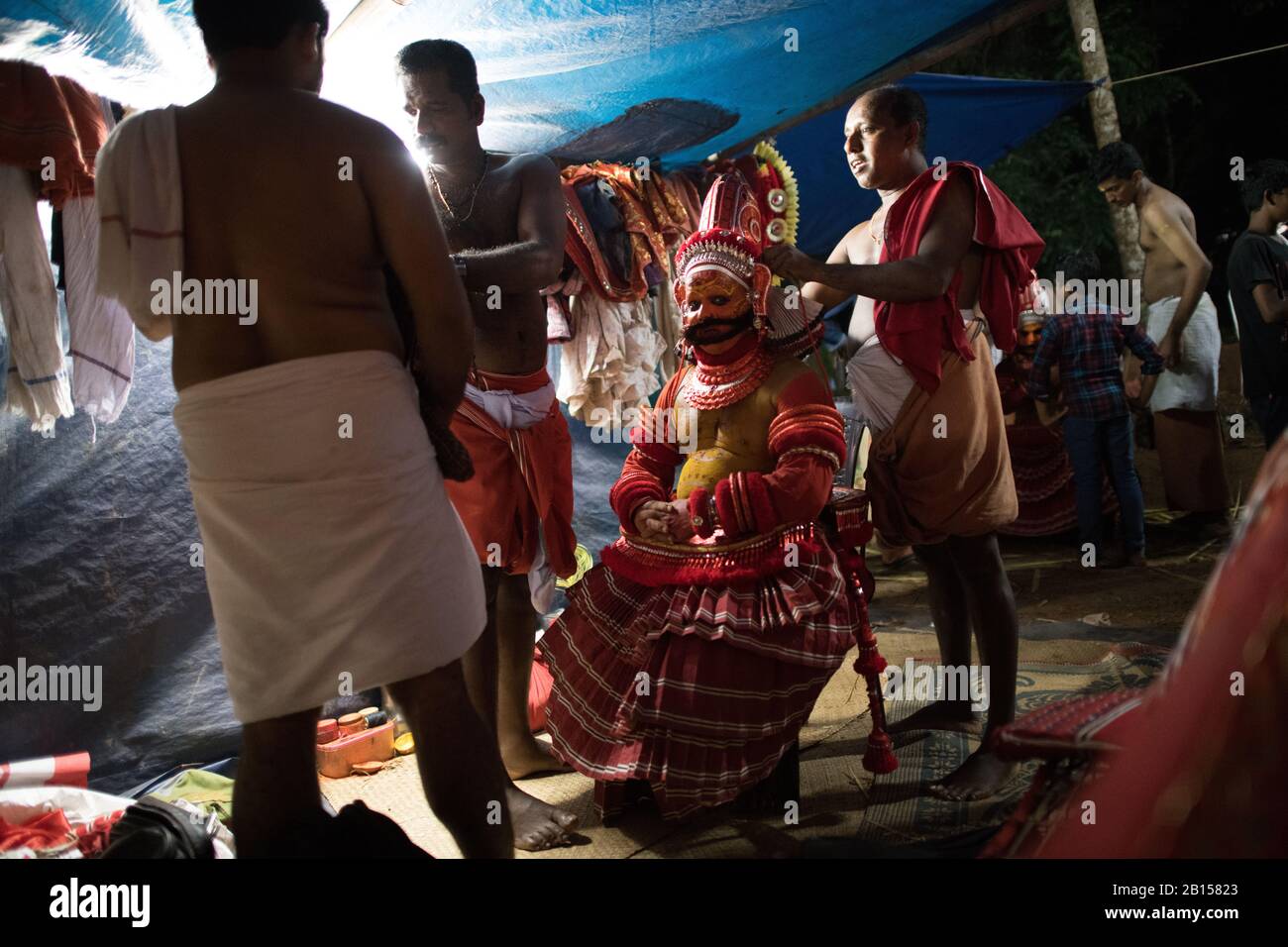 Preparing for Theyyam performance a popular ritual form of worship in