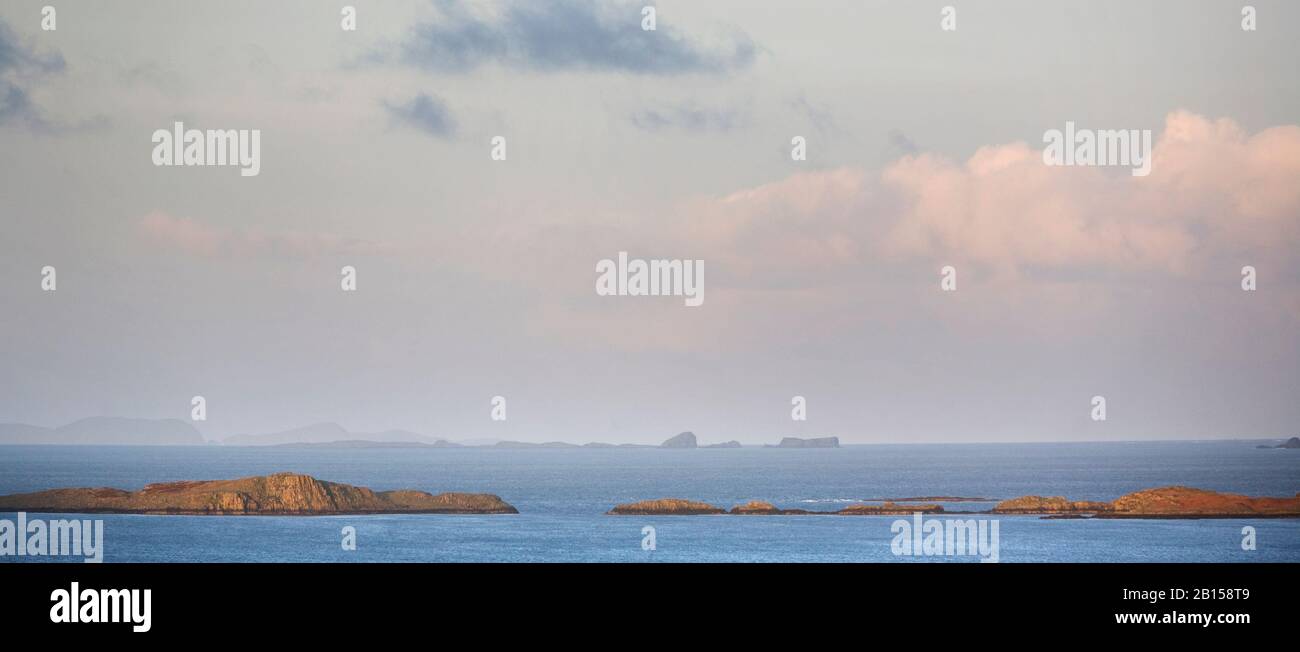 The Shiant Isles in the distance behind the Ascrib Islands, seen from the Isle of Skye, Western Isles, North West Scotland, United Kingdom, Britain Stock Photo