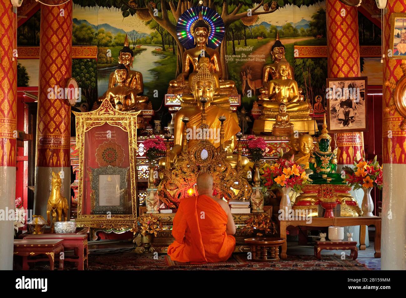 Chiang Mai Thailand - Temple Lok Moli meditation hall with meditating monk Stock Photo