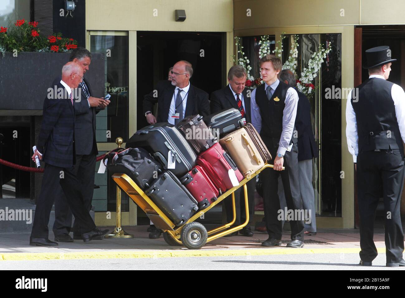 Staff with luggage outside the Grand Hotel before the wedding between Crown Princess Victoria and Prince Daniel. The wedding of Victoria, Crown Princess of Sweden, and Daniel Westling took place on 19 June 2010 in Stockholm Cathedral.Stockholm 2010-06-19 Photo Jeppe Gustafsson Stock Photo