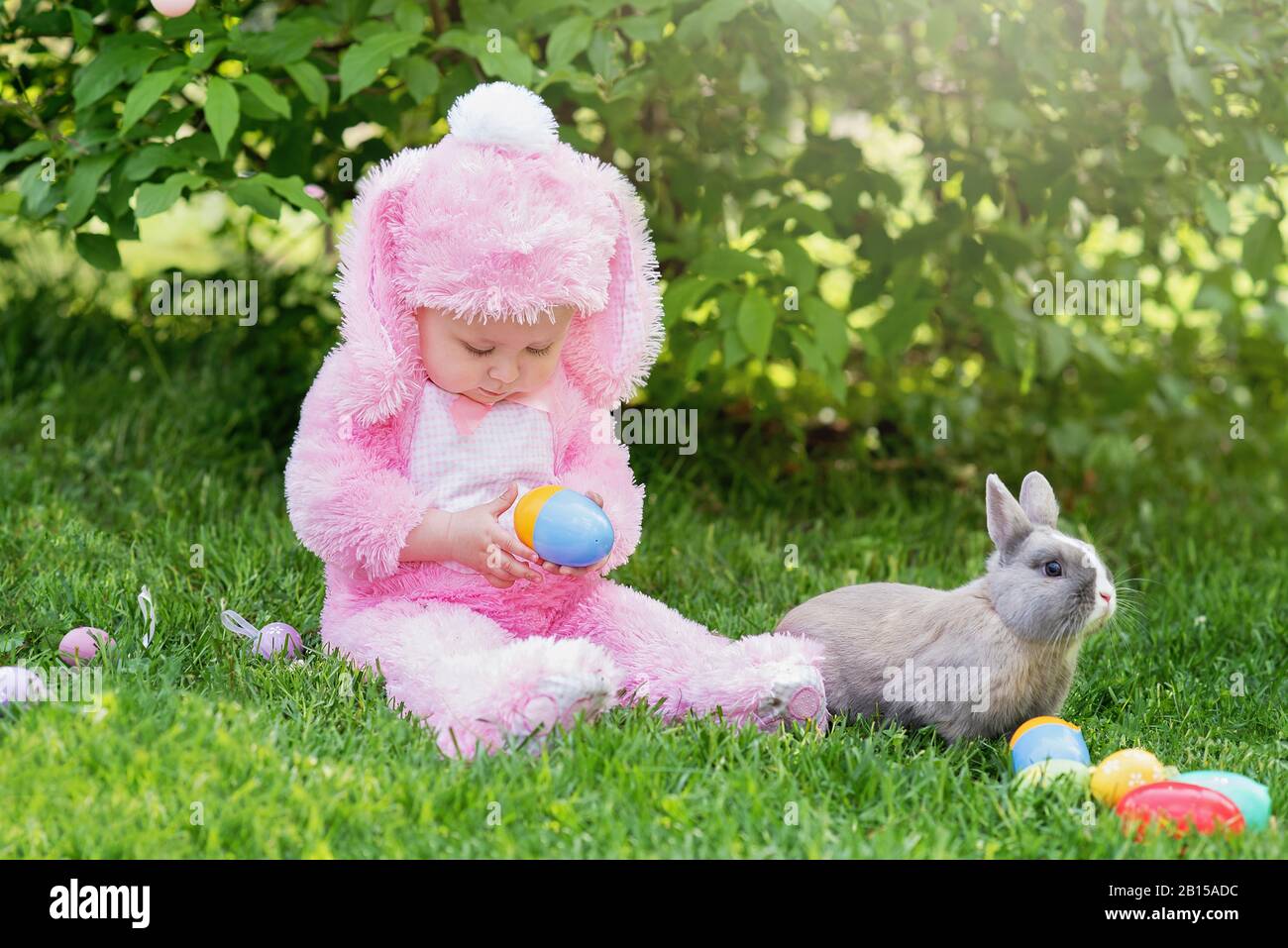 https www alamy com child play with real rabbit at easter egg hunt with pet bunny little toddler girl playing with animal in garden cute funny girl with easter eggs and image344939992 html