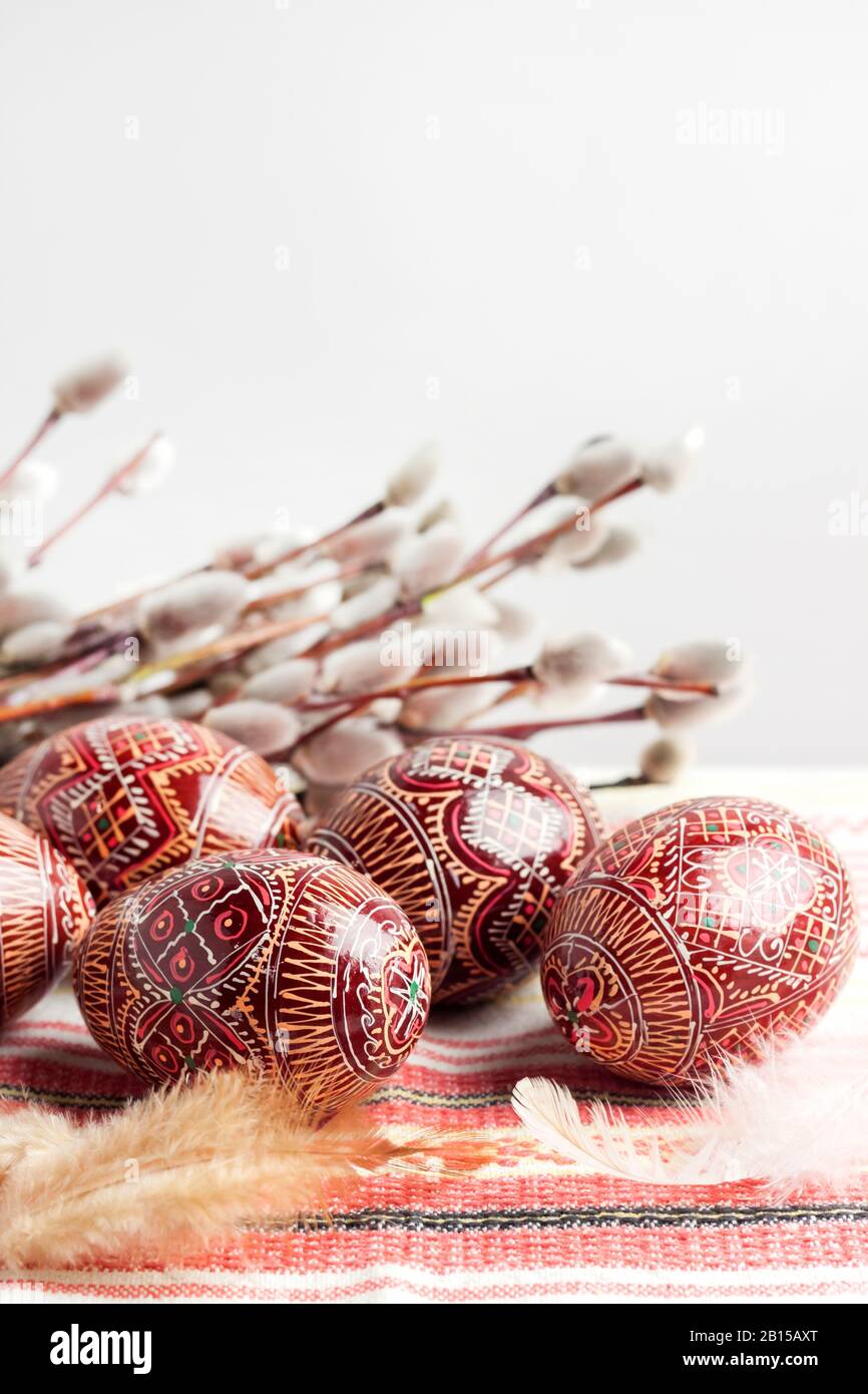 Easter still life with Pysanka on traditional Ukrainian cloth. Decorated Easter eggs, traditional for Eastern Europe culture. Copy space Stock Photo