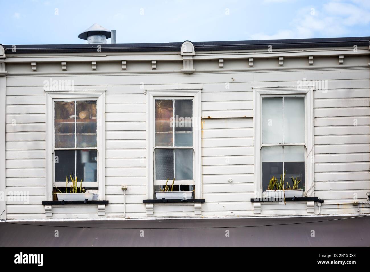 Side wall of vintage wooden building at Auckland, New Zealand. Stock Photo
