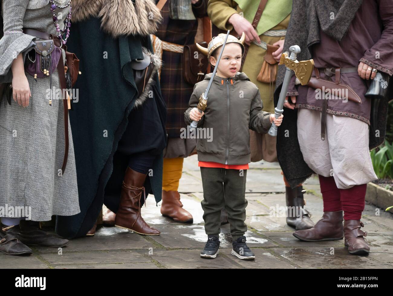 George Nuttall has is photograph taken with Viking re-enactors during the Jorvik Viking Festival in York, recognised as the largest event of its kind in Europe. Stock Photo