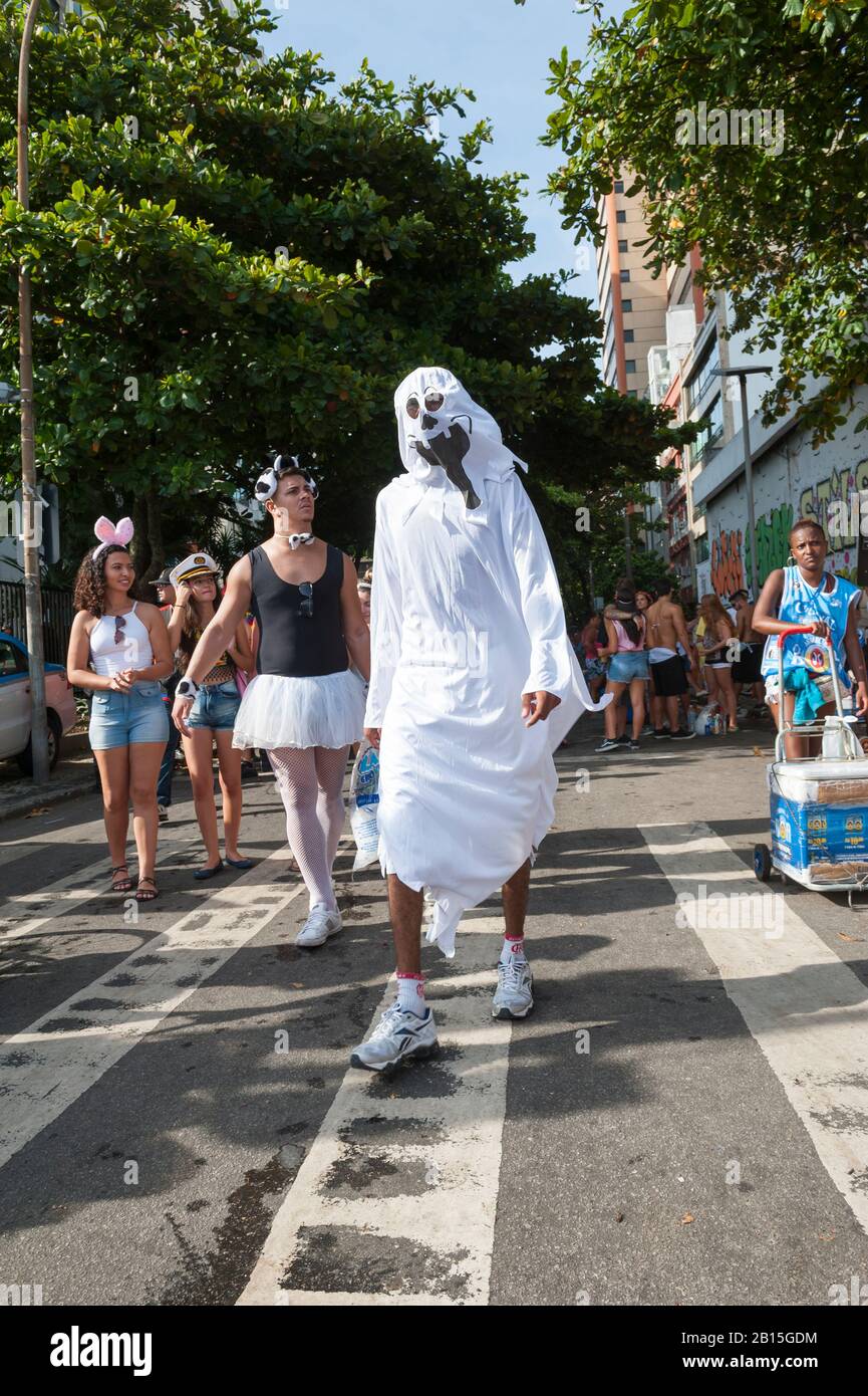 RIO DE JANEIRO - CIRCA JANUARY, 2016: An afternoon banda street party in Ipanema draws young Brazilians in funny costumes during the city's Carnival Stock Photo