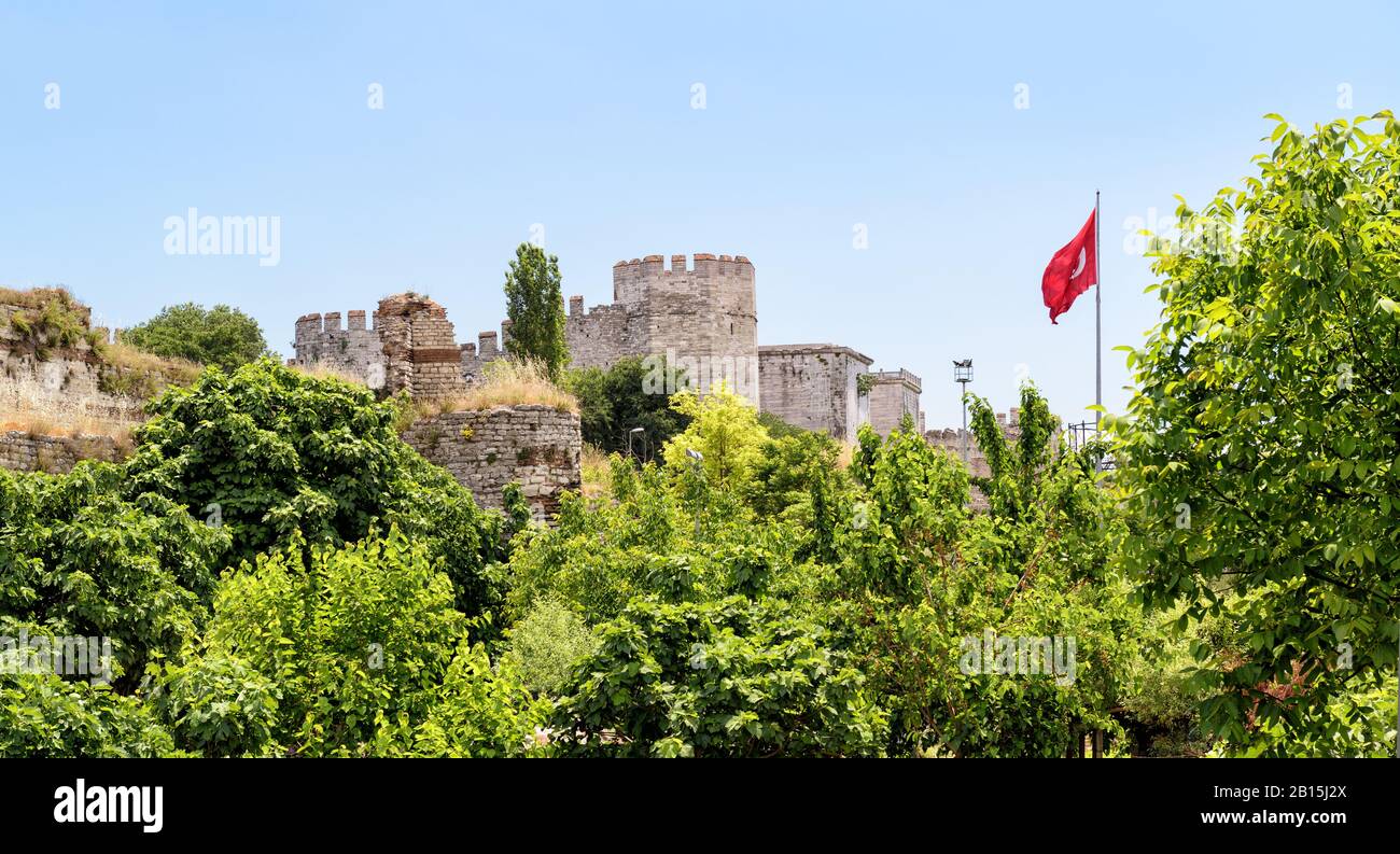 The Yedikule Fortress (Castle of Seven Towers) and ancient walls of Constantinople with Turkish flag in Istanbul, Turkey Stock Photo