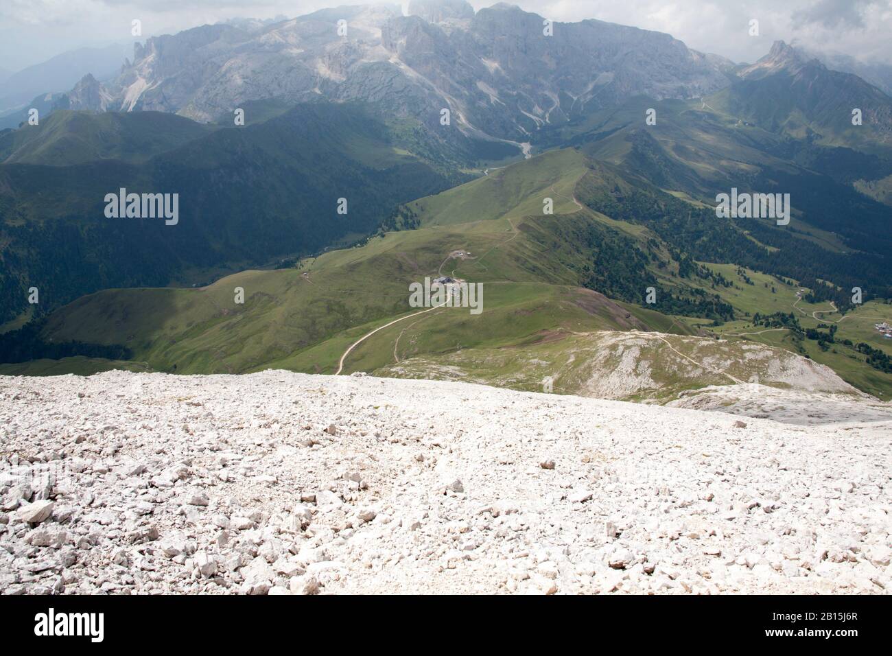 The path ascending the rocky western face of the Plattkofel rising above the Friedrich August Weg the Val Gardena Dolomites South Tyrol Italy Stock Photo