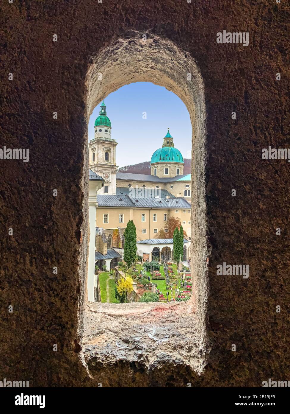 Salzburg Cathedral and St Peter Cemetery, the spiritual heart of Salzburg, Austria, Europe. Seen through a window of the Catacombs. Stock Photo