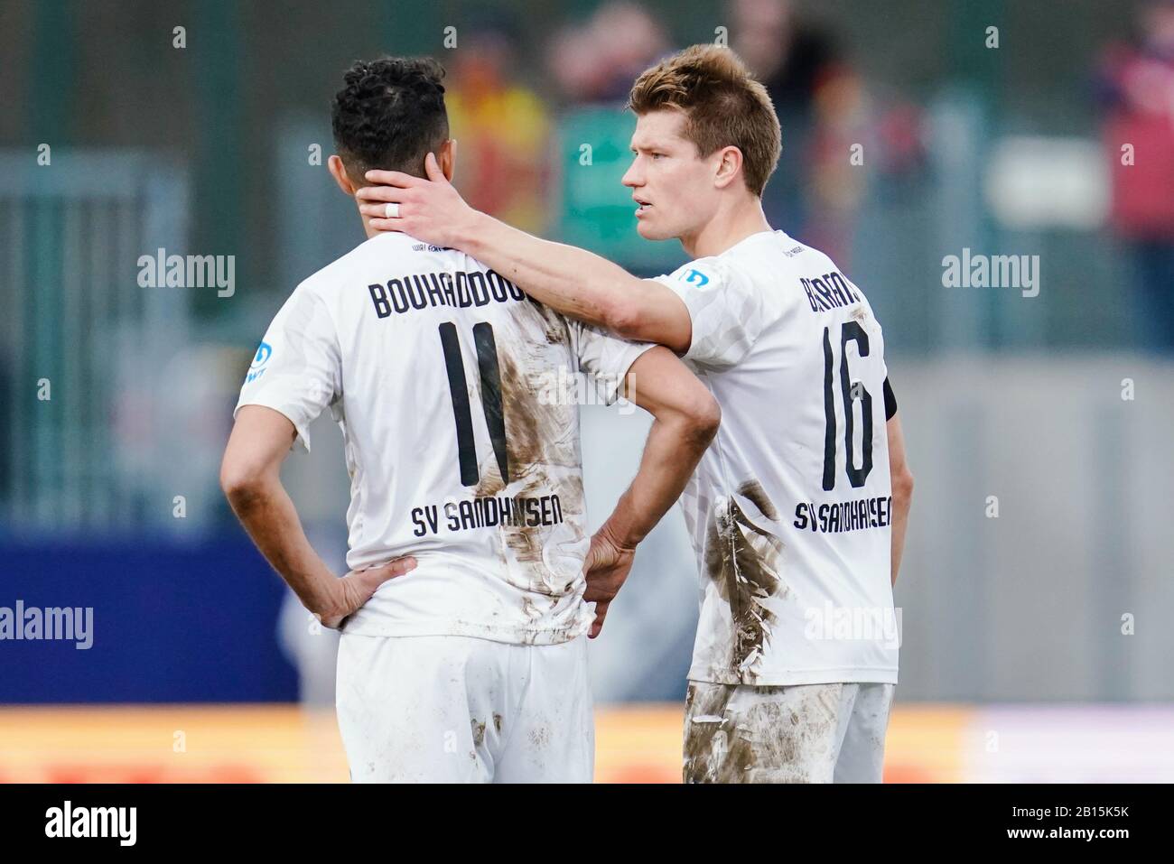 Sandhausen, Germany. 23rd Feb, 2020. Football: 2nd Bundesliga, 23rd matchday, SV Sandhausen - Karlsruher SC, at the Hardtwaldstadion. Sandhausen's Aziz Bouhaddouz (l) and Sandhausen's Kevin Behrens are on the field of play after the end of the game. Credit: Uwe Anspach/dpa - IMPORTANT NOTE: In accordance with the regulations of the DFL Deutsche Fußball Liga and the DFB Deutscher Fußball-Bund, it is prohibited to exploit or have exploited in the stadium and/or from the game taken photographs in the form of sequence images and/or video-like photo series./dpa/Alamy Live News Stock Photo