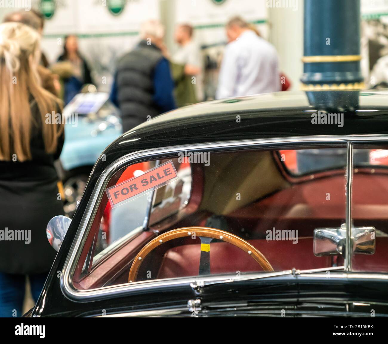 22 Feb 2020 - London, UK. Close up detail of a classic car advertised for sale in the exhibition. Stock Photo