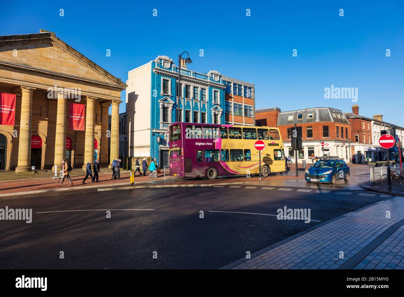 A town bus pulls away outside The Cotswold camping and outdoor store on