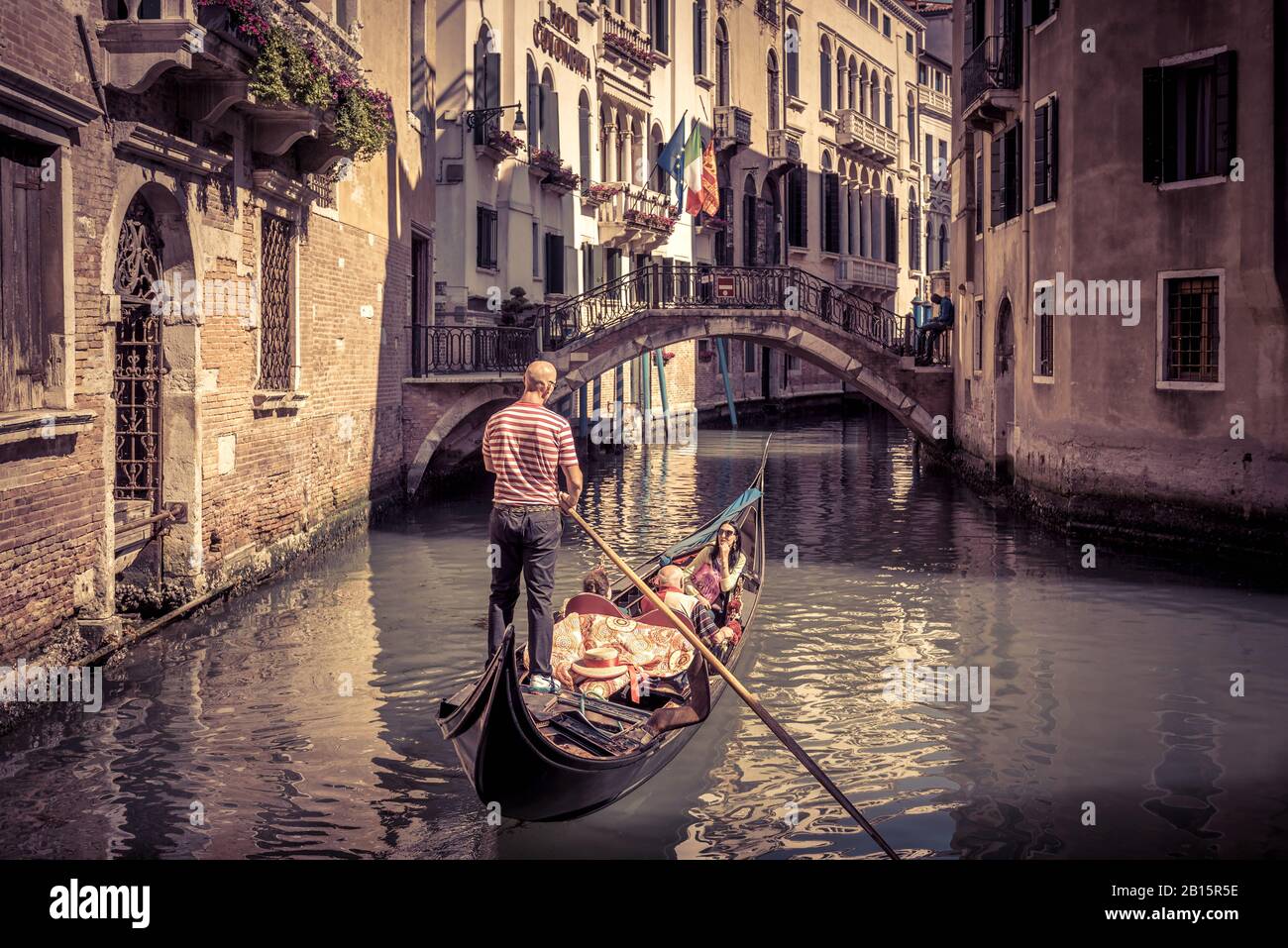 Venice, Italy May 21, 2017 The gondola floats along the old narrow street in Venice. Gondola
