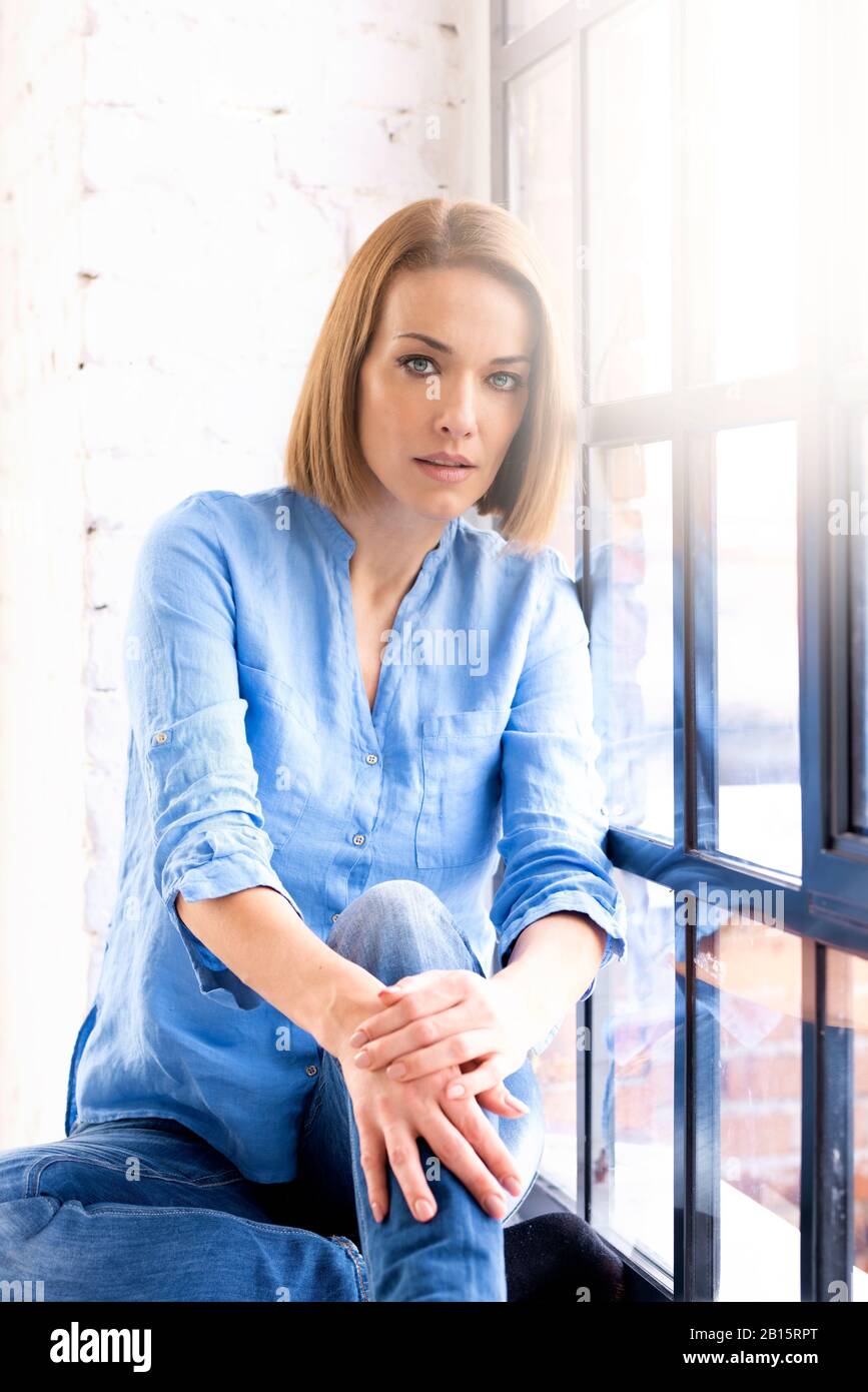 Portrait shot of attractive middle aged woman wearing shirt and