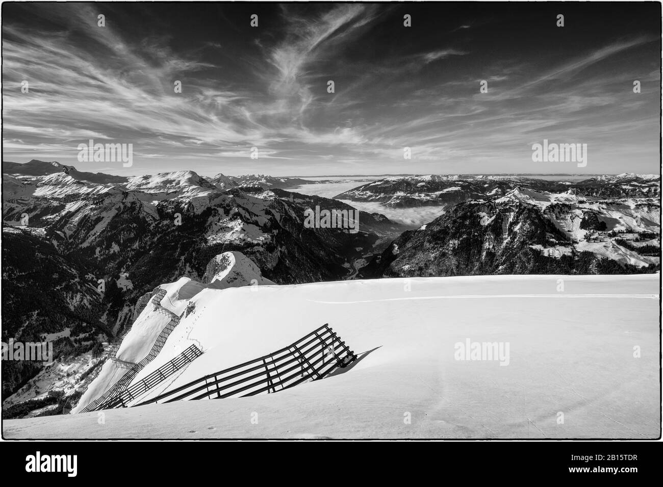 Black and white photo of avalanche protection barriers at the Männlichen, Bernese Oberland, Switzerland Stock Photo