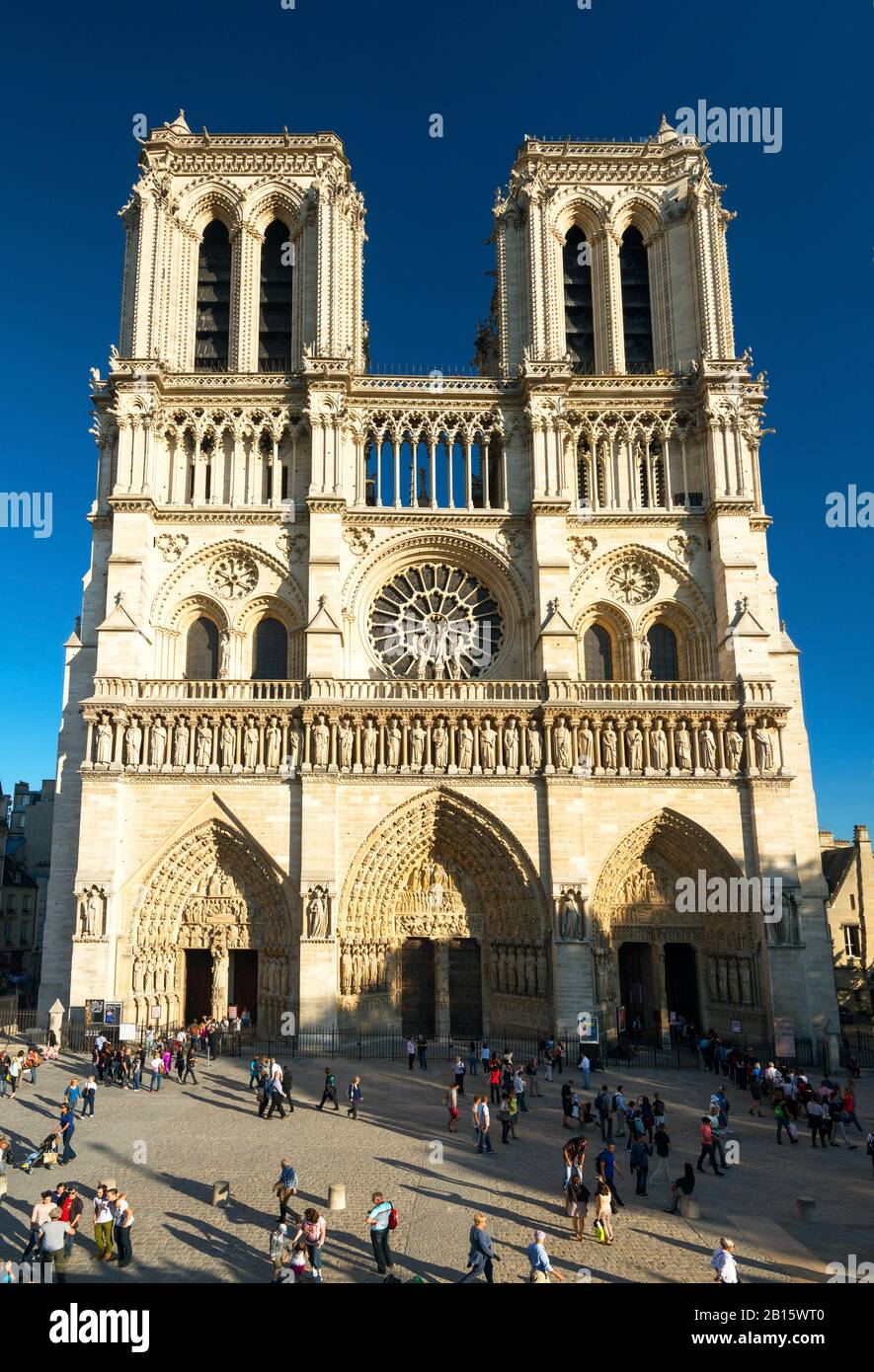 PARIS - SEPTEMBER 24: Tourists visiting the Cathedral of Notre Dame de Paris on september 24, 2013. Notre Dame is one of the top tourist destinations Stock Photo