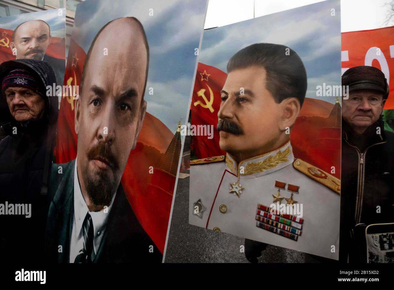 Moscow, Russia. 23rd of February, 2020 Participants in a rally and a march in central Moscow marking the 102nd anniversary of the founding of the Soviet Red Army and the Soviet Navy. People hold banners with portrait of Soviet Russian leaders Josef Stalin and Vladimir Lenin Stock Photo