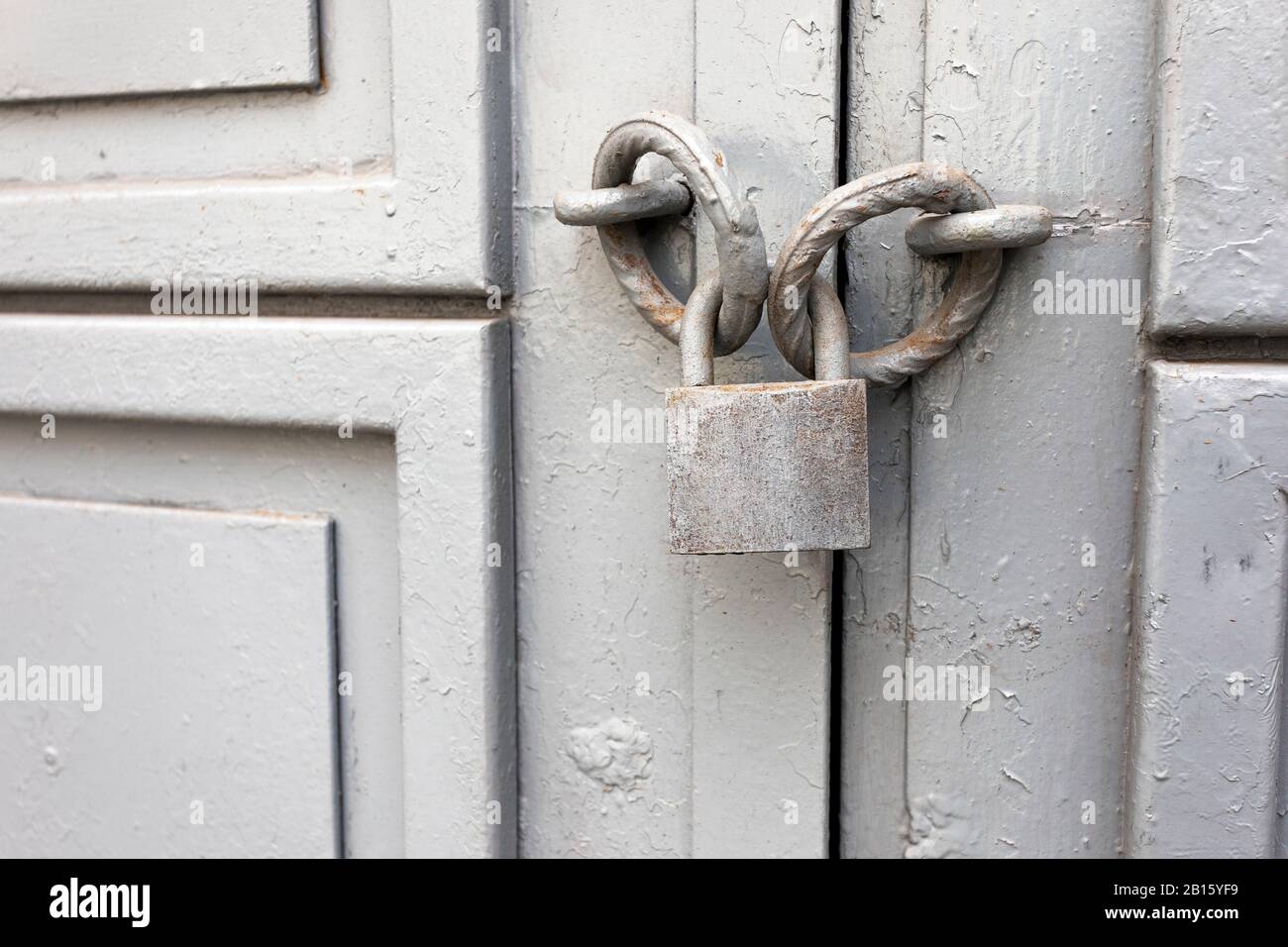 Old grey vintage lock on an iron door. Background Stock Photo - Alamy