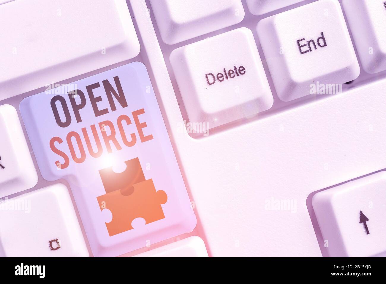 Writing note showing Open Source. Business concept for denoting software which original source code is made free Stock Photo