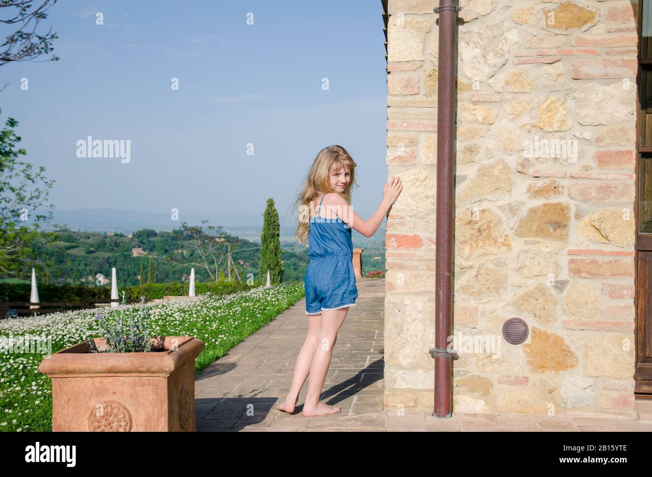 adorable little child next the typical italian building Stock Photo