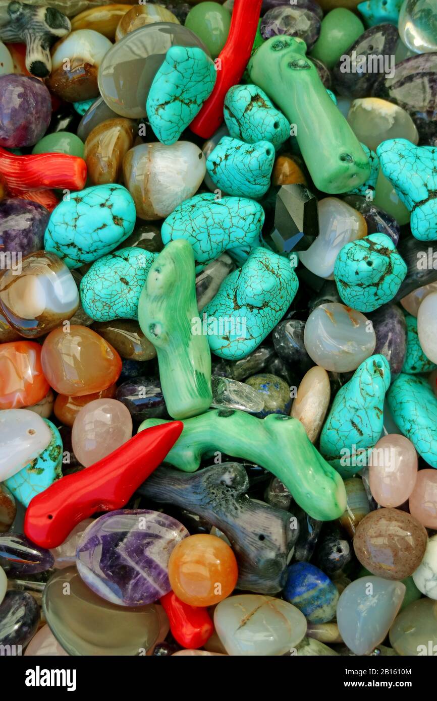Vertical image of heap of multi color semi precious stones for background or banner Stock Photo