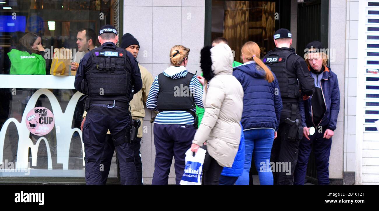 Greater Manchester Police Officers talk to people in Piccadilly Gardens, Manchester, uk. The media has reported many crimes in this inner city area recently, putting pressure on the police to give this district more attention. Stock Photo